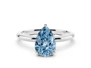 Fancy Blue Pear Cut Diamond Solitaire Engagement Ring Set in Silver with Prong Setting and Polished Band