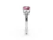 Fancy Pink Princess Cut Diamond Cluster Ring Set in Platinum with Round Accent Stones and Prong Setting on a Plain Band
