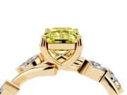 Fancy Yellow Emerald Cut Diamond Solitaire Ring Set in Yellow gold with Twisted Marquise Accent Band