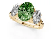 Fancy Green Oval Cut Diamond Three-Stone Ring Set in Yellow gold with Braided Band