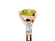 Fancy Yellow Heart Cut Diamond Solitaire Ring Set in Rose gold with Tapered Baguette Side Stones and Prong Setting
