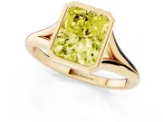 Fancy Yellow Bezel Set Radiant Cut Diamond Solitaire Ring Set in Yellow gold with Tapered Band