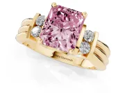 Fancy Pink Three-Stone Radiant Cut Diamond Channel Set Ring Set in Yellow gold with Bar Prongs