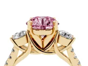 Fancy Pink Three-Stone Round Cut Diamond Pavé Band Ring Set in Yellow gold with Prong-Set Trio