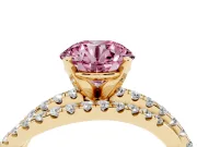 Fancy Pink Round Cut Diamond Solitaire Twist Band Ring Set in Yellow gold with Pavé Setting and Prong Head