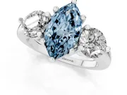 Fancy Blue Marquise Cut Diamond Three-Stone Ring Set in Platinum with Prong Setting and Classic Band