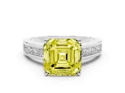Fancy Yellow Asscher Cut Diamond Solitaire Ring Set in Platinum with Channel-Set Band and Prong Setting