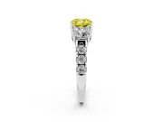 Fancy Yellow Cushion Cut Diamond Three-Stone Ring Set in Platinum with Pavé Band