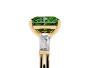 Fancy Green Radiant Cut Diamond Solitaire Ring Set in Yellow gold with Tapered Baguette Side Stones and Prong Setting