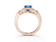 Fancy Blue Asscher Cut Diamond Cluster Ring Set in Rose gold with Round Accent Stones and Prong Setting on a Plain Band