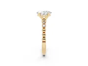 Oval Cut Diamond Solitaire Engagement Ring Set in Yellow gold with Bezel Accents on Beaded Band