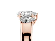 Three-Stone Pear Cut Diamond Ring Set in Rose gold with Matching Prong Settings and Plain Band