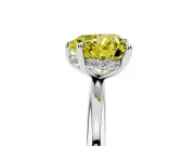 Fancy Yellow Heart Cut Diamond Solitaire Ring Set in Platinum with Thin Band and Prong Setting