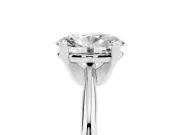 Oval Cut Diamond Solitaire Ring Set in Platinum with Prong Setting on a Plain Round Band