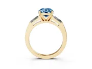 Fancy Blue Round Cut Diamond Solitaire Ring Set in Yellow gold with Tapered Baguette Side Stones and Prong Setting