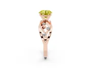 Fancy Yellow Round Cut Diamond Solitaire Ring Set in Rose gold with Side Stones on Criss-Cross Band and Prong Setting