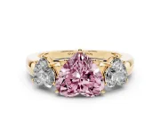 Fancy Pink Heart Cut Diamond Three-Stone Ring Set in Yellow gold with Bold Center and Classic Band