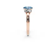 Fancy Blue Oval Cut Diamond Three-Stone Ring Set in Rose gold with Bold Center and Classic Band
