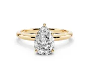 Pear Cut Diamond Solitaire Engagement Ring Set in Yellow gold with Prong Setting and Polished Band