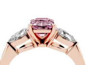 Fancy Pink Three-Stone Emerald Cut Diamond Ring Set in Rose gold with Pear Side Stones and Prong Setting