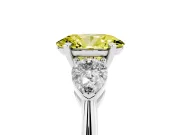 Fancy Yellow Three-Stone Oval Cut Diamond Ring Set in White gold with Pear Side Stones and Prong Setting