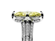 Fancy Yellow Marquise Cut Diamond Pavé Split Shank Solitaire Ring Set in White gold with Prong Setting