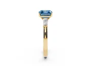 Fancy Blue Asscher Cut Diamond Solitaire Ring Set in Yellow gold with Tapered Baguette Side Stones and Prong Setting