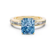 Fancy Blue Radiant Cut Diamond Solitaire Ring Set in Yellow gold with Channel-Set Baguette Band and Prong Setting