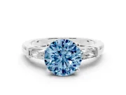 Fancy Blue Round Cut Diamond Solitaire Ring Set in Silver with Tapered Baguette Side Stones and Prong Setting