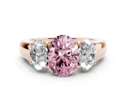 Fancy Pink Three-Stone Oval Cut Diamond Ring Set in Rose gold with Matching Prong Settings and Plain Band