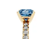 Fancy Blue Princess Cut Diamond Solitaire Pavé Engagement Ring Set in Yellow gold with Round Band and Prong Setting