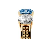 Fancy Blue Cushion Cut Diamond Three-Stone Ring Set in Yellow gold with Textured Band