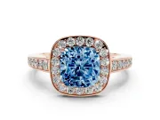 Fancy Blue Cushion Cut Diamond Halo Pavé Engagement Ring Set in Rose gold with Bezel Setting