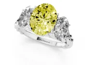 Fancy Yellow Oval Cut Diamond Three-Stone Ring Set in White gold with Braided Band