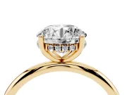 Round Cut Diamond Solitaire Engagement Ring Set in Yellow gold with Prong Setting and Polished Band