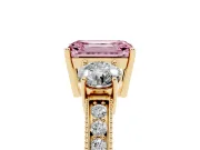 Fancy Pink Emerald Cut Diamond Three-Stone Ring Set in Yellow gold with Round Side Stones and Pavé Band