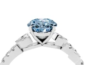 Fancy Blue Oval Cut Diamond Solitaire Leaf-Inspired Ring Set in Platinum with Pavé Band and Prong Setting