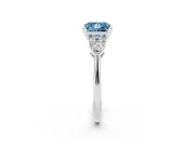 Fancy Blue Three-Stone Princess Cut Diamond Ring Set in White gold with Pear Side Stones and Prong Setting