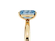 Fancy Blue Emerald Cut Diamond Solitaire Ring Set in Yellow gold with Prong Setting on a Polished Plain Band