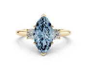Fancy Blue Three-Stone Marquise Cut Diamond Ring Set in Yellow gold with Prong Setting and Plain Band