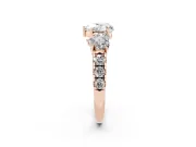 Heart Cut Diamond Three-Stone Ring Set in Rose gold with Pavé Band