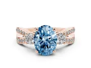 Oval Three-Stone Twist Engagement Ring Setting for a Fancy Blue Lab-Grown Diamond | Rose Gold