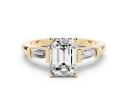 Emerald Cut Diamond Solitaire Ring Set in Yellow gold with Tapered Baguette Accents and Prong Setting