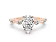 Pear Cut Diamond Solitaire Ring Set in Rose gold with Bezel Set Side Stones and Prong Setting
