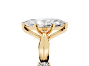 Marquise Cut Diamond Solitaire Twisted Band Ring Set in Yellow gold with Accent Stones and Prong Setting