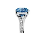 Fancy Blue Round Cut Diamond Solitaire Ring Set in Platinum with Pavé Accent Band and Classic Prong Setting