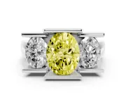 Fancy Yellow Oval Cut Diamond Three-Stone Channel Set Ring Set in White gold with Smooth Polished Band
