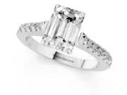 Emerald Cut Diamond Solitaire Engagement Ring Set in Silver with Delicate Pavé Band and Prong Setting