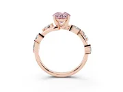 Fancy Pink Oval Cut Diamond Solitaire Ring Set in Rose gold with Twisted Marquise Accent Band