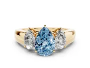 Fancy Blue Three-Stone Pear Cut Diamond Ring Set in Yellow gold with Matching Prong Settings and Plain Band